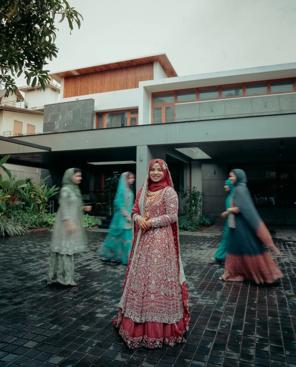 A bride looking in to the camera with a smile, Clicked by the best wedding photographer in kannur