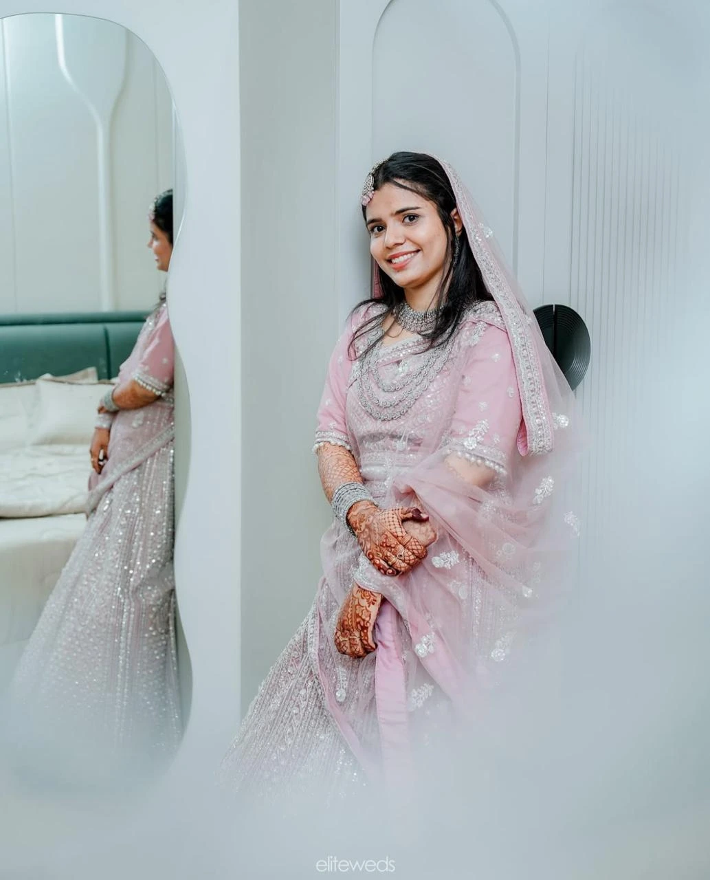 A Bride looking in to the camera with a smile, Clicked by the best wedding photographer in kannur